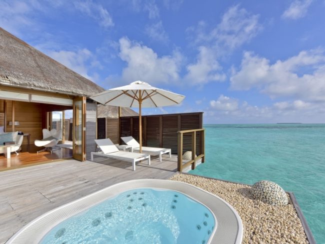 Outdoor jacuzzi on overwater villa