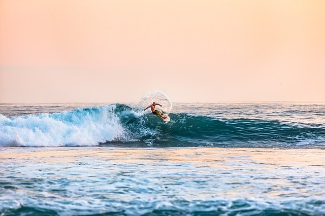 Surfing to burn off calories when traveling