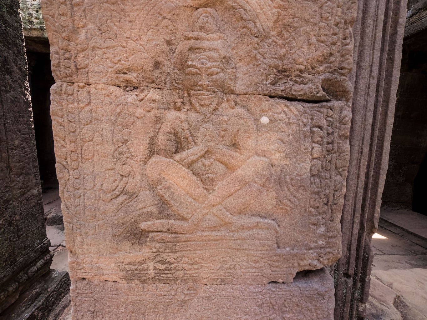 Hindu Buddha sitting out of full lotus position