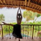 Yoga stretching with a great view of Cempedak Island