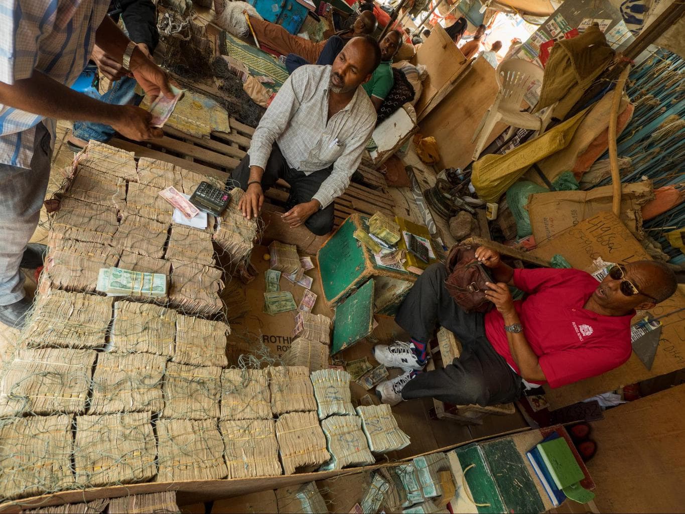Piles of Somali Shilling at the stall of a money changer in Hargeisa