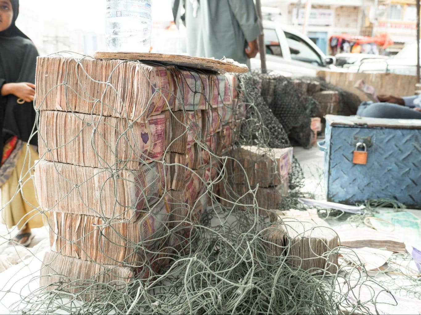 Stacks of Somali Shillings under a net. The safe stores foreign currency