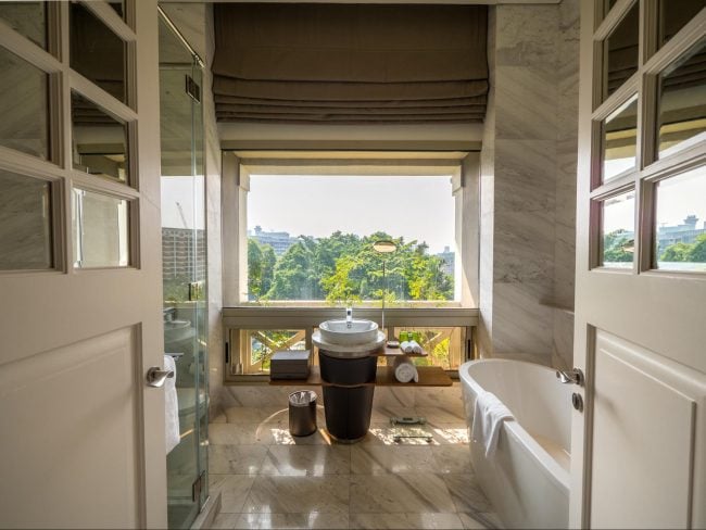 The glass enclosed verandah bathrooms at Hotel Fort Canning