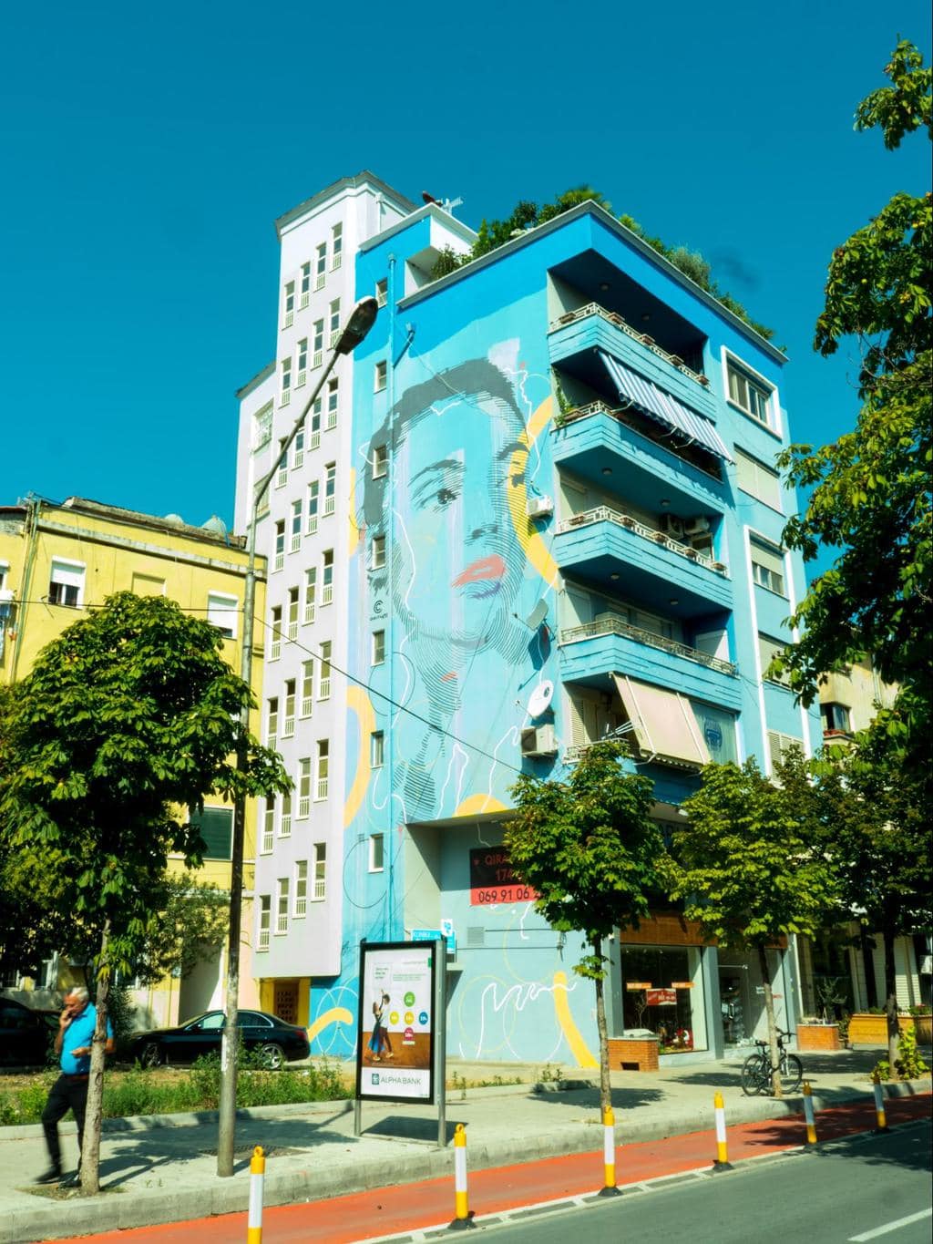 Blue portrait wall mural in Blloku