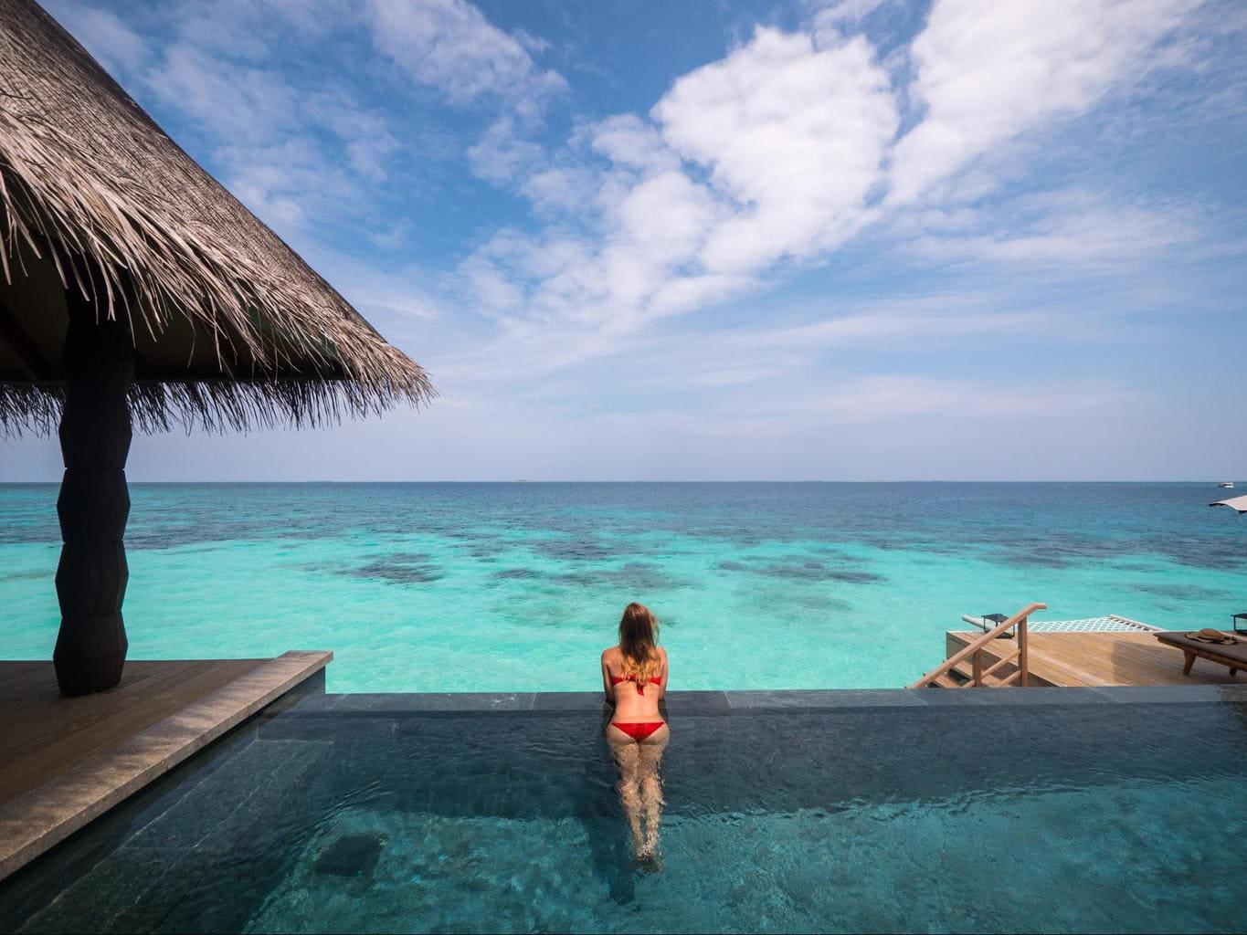 Infinity pool of the over water villas at Joali Maldives