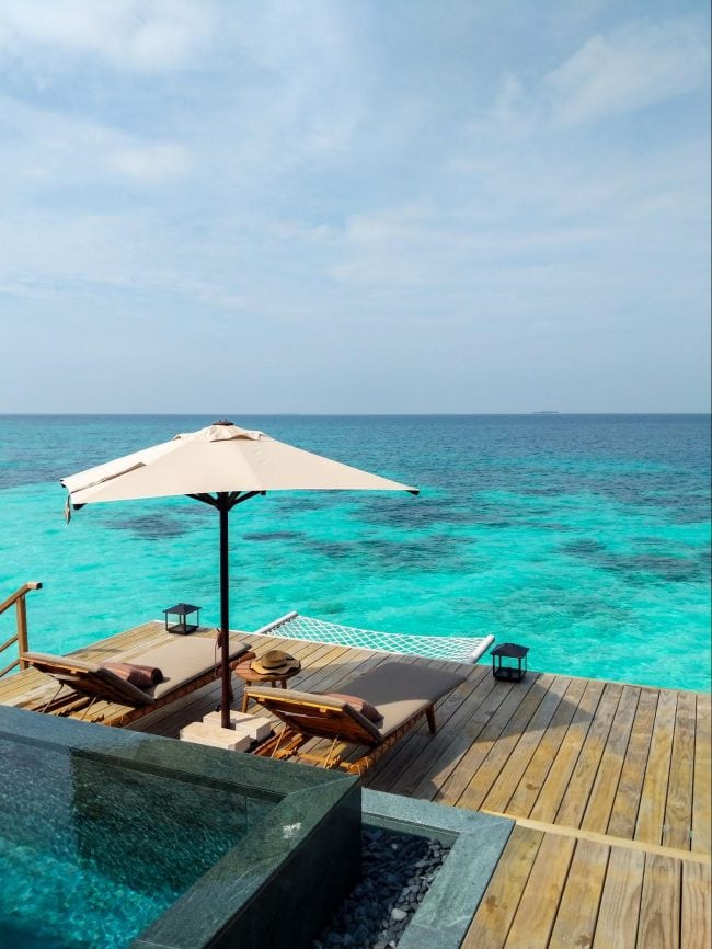 Outdoor decks at the over water villas at Joali Maldives