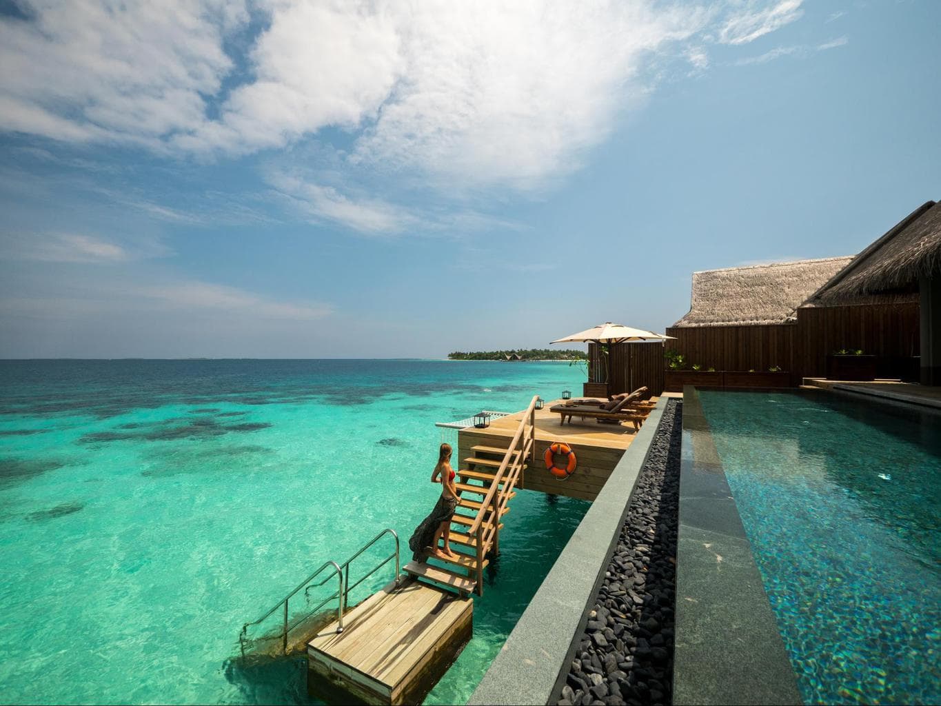 Outdoor decks of the over water villas at Joali Maldives