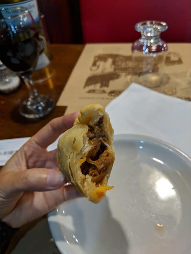 Inside an Argentinian beef, cheese and ham empanada