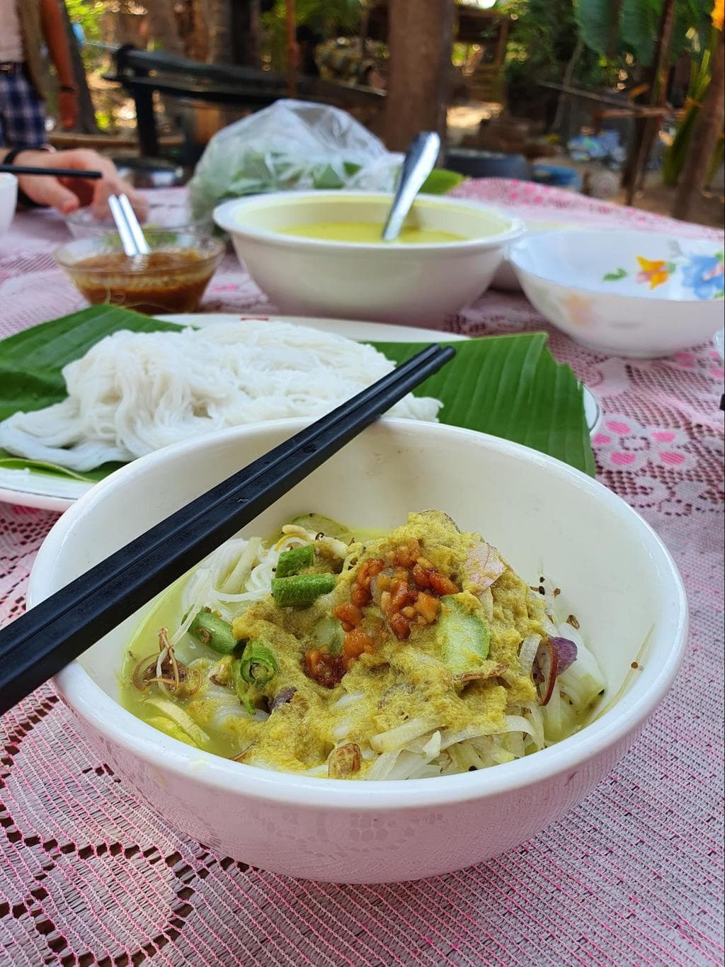 Enjoying Cambodian breakfast noodles