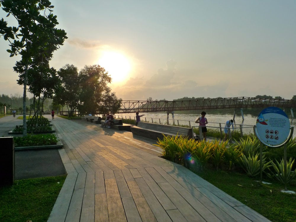 Sunrise at the Riverside Walk and the railway-like Lorong Halus Bridge in the distance